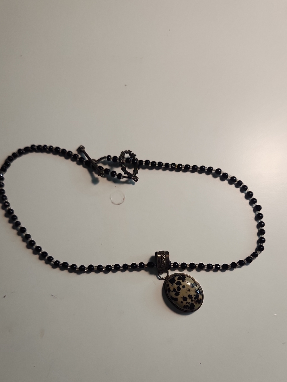 Black Beaded Necklace with Speckled Oval Pendant Dalamatian stone